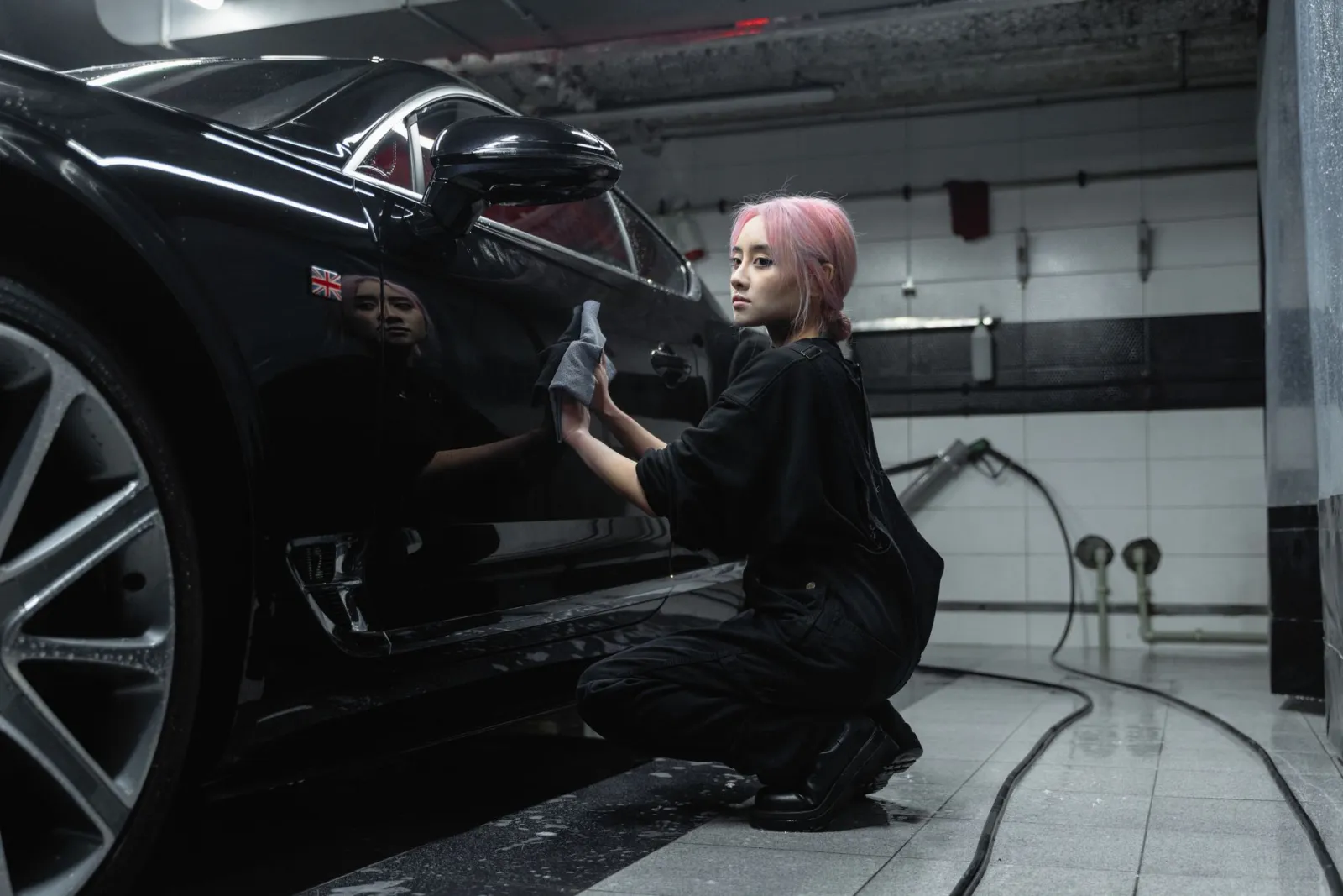 technician applying paint protection film in a climate-controlled bay