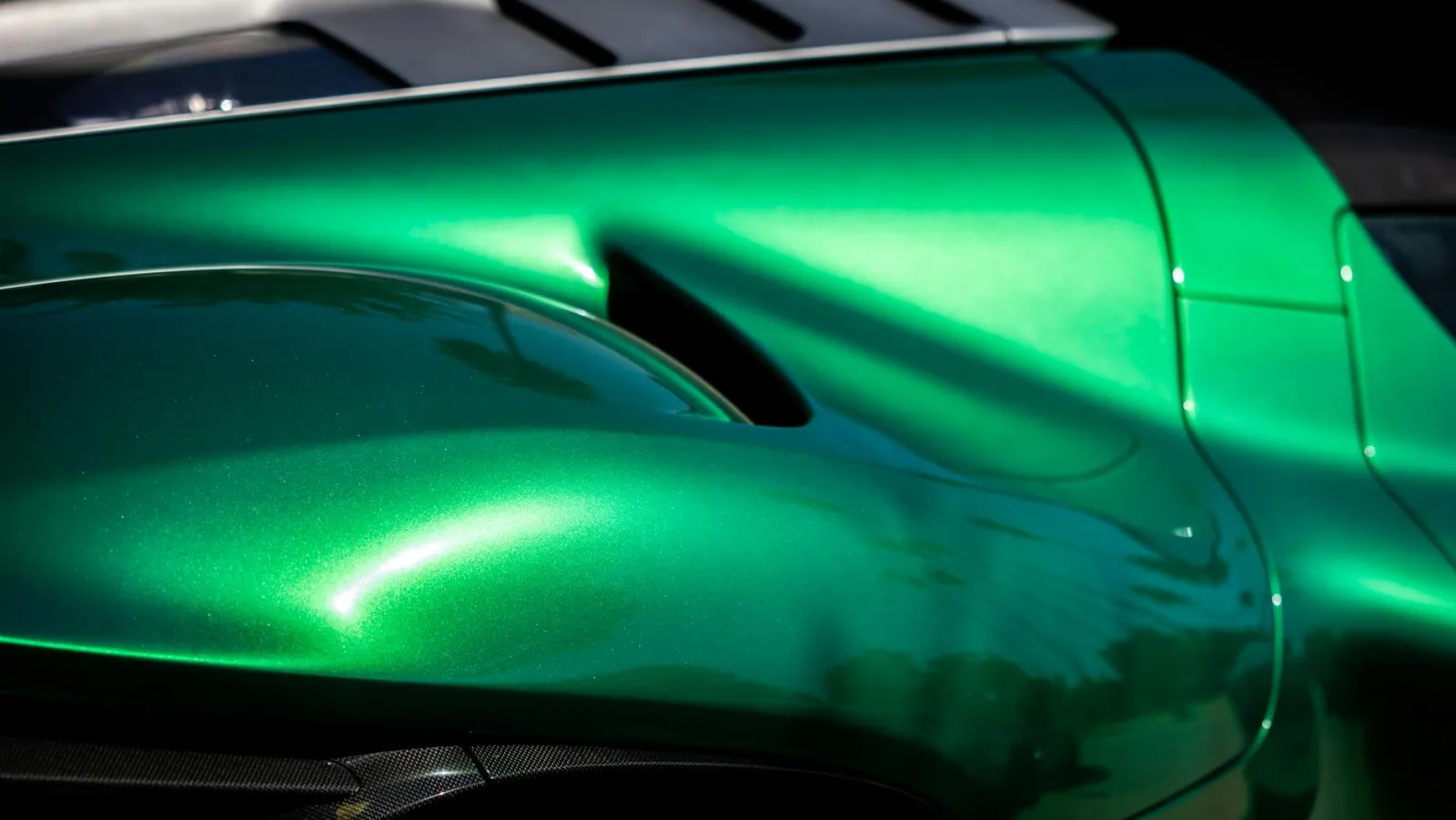 Close-up of automotive paint surface showing heat and UV exposure effects