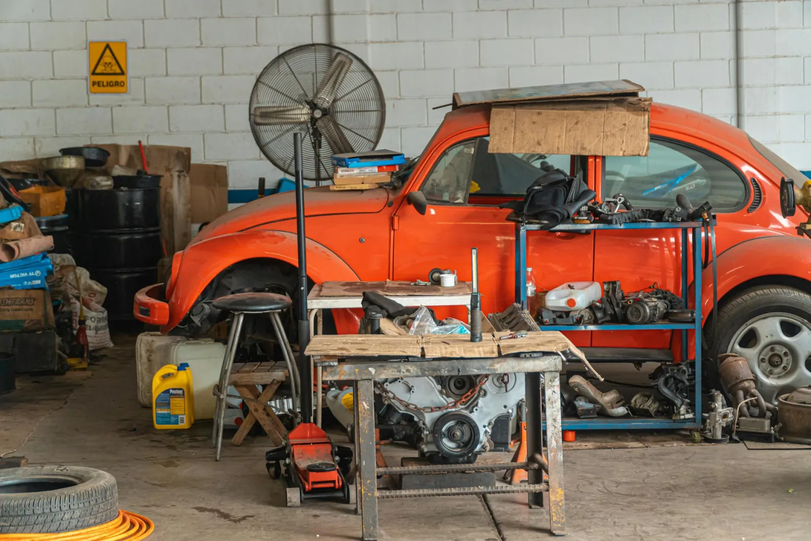 Vehicle covered and parked in a clean private garage