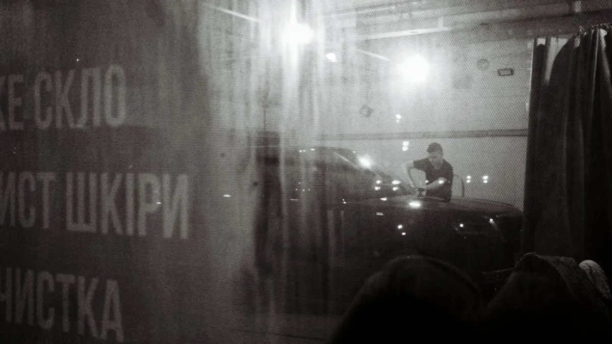 Car parked near home construction site with dust and debris concerns